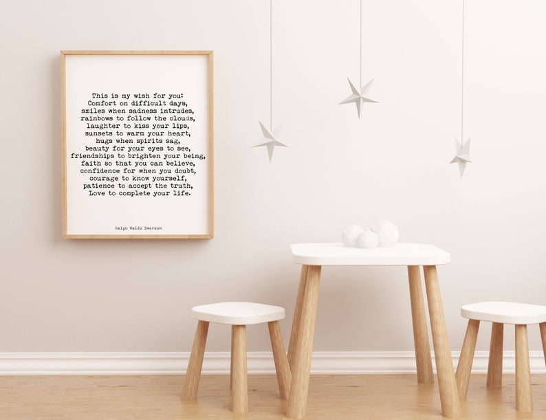 May include: A framed print with a white background and black text. The text is a poem about wishing for comfort, smiles, rainbows, laughter, sunsets, hugs, beauty, friendships, faith, confidence, courage, patience, and love. The poem is titled "This is my wish for you" and is signed "Nigel Hale Emerson".