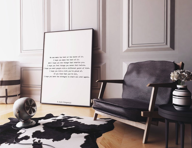 May include: A framed vertical wall art print featuring black typewriter-style text on a white background. The quote reads: We can make the best or the worst of it. I hope you make the best of it. F. Scott Fitzgerald is signed at the bottom.