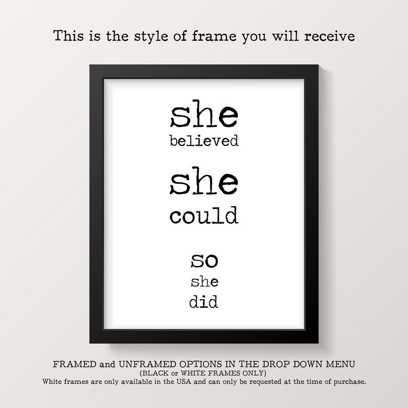 May include: A black framed print with the text "she believed she could so she did" in a typewriter font.