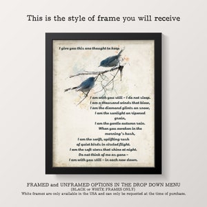 May include: A framed print with a white background and a poem about nature and the passage of time. The poem is written in a cursive font and features two blue birds perched on a branch. The frame is black and has a white mat.