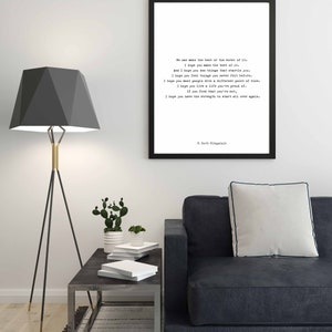May include: A rectangular black frame containing a white print with black typewriter-style text. The quote reads: We can make the best or the worst of it. I hope you make the best of it. And I hope you see things that startle you. F. Scott Fitzgerald.