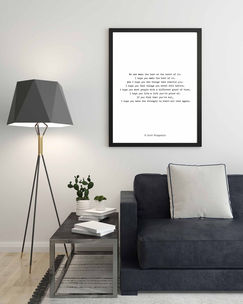 May include: A rectangular black frame containing a white print with black typewriter-style text. The quote reads: We can make the best or the worst of it. I hope you make the best of it. And I hope you see things that startle you. F. Scott Fitzgerald.