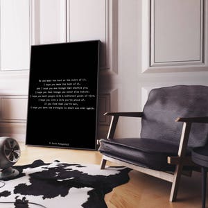 May include: A rectangular black framed wall art piece featuring white text that reads: We can make the best or the worst of it. I hope you make the best of it. And I hope you see things that startle you. I hope you feel things you never felt before.