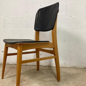 Vintage chair: wood and black imitation leather