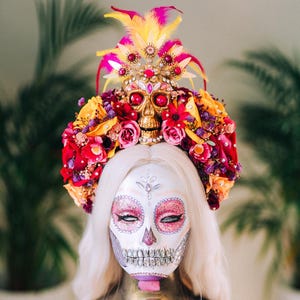 pink day of the dead dress Woman Wears Sugar Skull Mask and Bright Pink Jalisco Dress in Celebration of Dia De Los Muertos / Day of the Dead Editorial Image