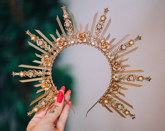 a jeweled headpiece similar to a crown is