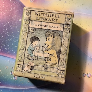 May include: A vintage book titled "Nutshell Library" by Maurice Sendak, featuring a black and white illustration of a boy and a lion reading together. The book is published by Collins.