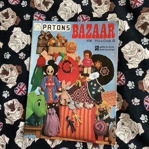 May include: A set of three ceramic mugs with a speckled, matte finish. The mugs are in shades of cream, light gray, and dark gray. Each mug has a simple, minimalist design, perfect for coffee or tea.