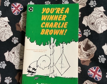 Libro de bolsillo de Peanuts de 1980: ¡Eres un ganador, Charlie Brown!