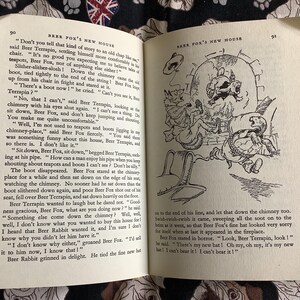 May include: An open book with illustrations and text. The left page features text and the number 90. The right page has a drawing of cartoon characters in a chimney, with the number 91.
