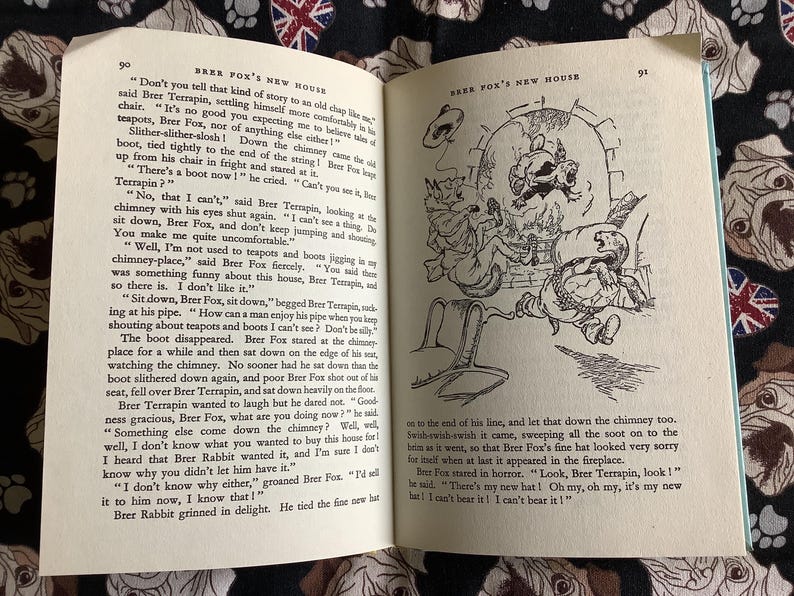 May include: An open book with illustrations and text. The left page features text and the number 90. The right page has a drawing of cartoon characters in a chimney, with the number 91.