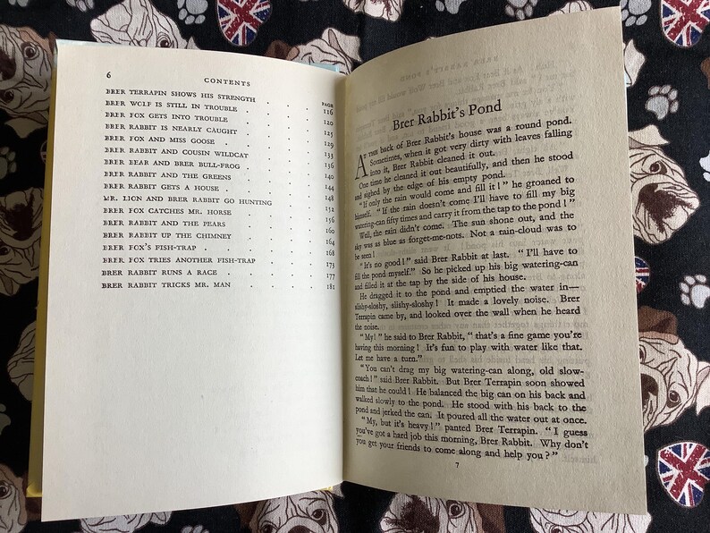 May include: Open book with text on aged paper. The left page lists a table of contents, including titles like "Brer Rabbit and the Greens." The right page features the story "Brer Rabbit's Pond."