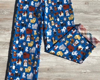 May include: Blue pajama pants with a pattern of various dog breeds. The pants have a plaid cuff at the bottom.