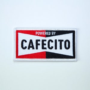 May include: White, red, and black embroidered patch with the text "POWERED BY CAFEICITO" in black.