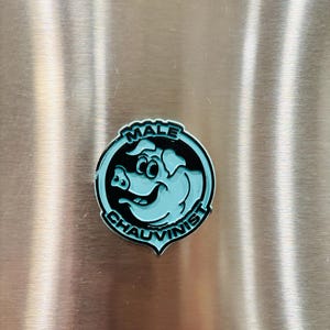 May include: A set of three ceramic mugs with a speckled, matte finish. The mugs are in shades of cream, light gray, and dark gray. Each mug has a simple, minimalist design, perfect for coffee or tea.