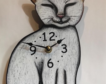 White Siamese cat with swinging tail!
