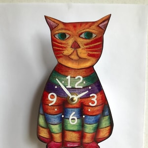 May include: A colourful cat-shaped clock with a rainbow striped body and a red and orange striped tail. The clock face has a white background with black numbers and hands.