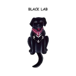May include: Black Labrador Retriever clock with a red bandana and a clock face on its chest. The clock's tail is the pendulum.
