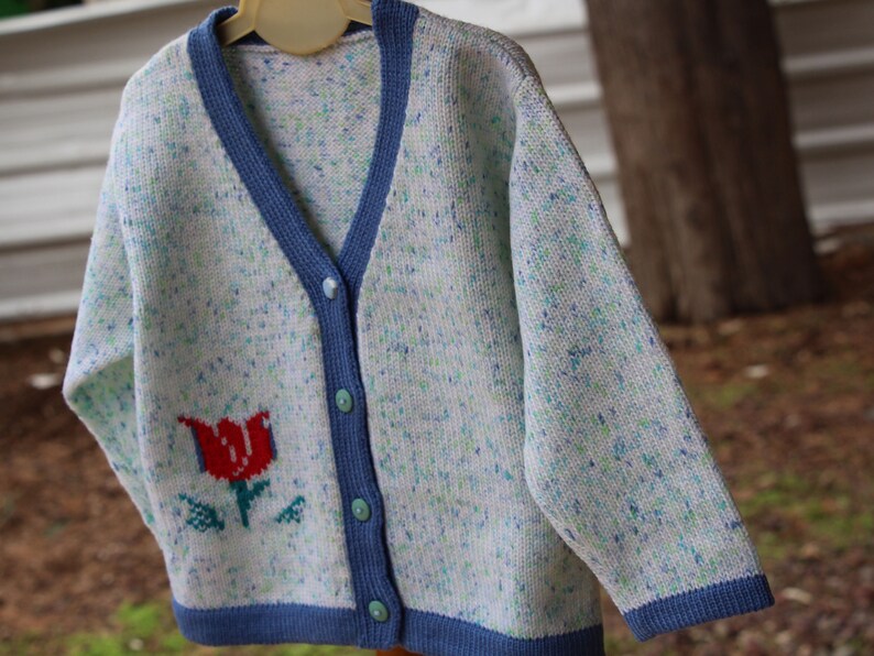 white knitted cardigan baby girl