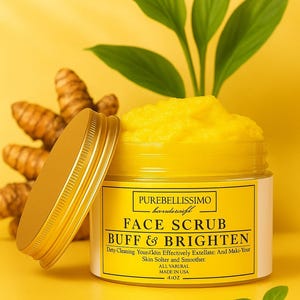 May include: A jar of yellow face scrub with the lid off, next to turmeric roots and green leaves. The label reads "FACE SCRUB BUFF & BRIGHTEN" and "41OZ". The background is a solid yellow.