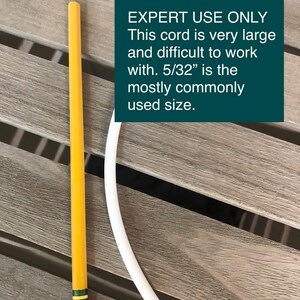 May include: A yellow pencil with a pink eraser and a white cord are on a wooden surface. A teal rectangle contains the text "EXPERT USE ONLY. This cord is very large and difficult to work with. 5/32" is the mostly commonly used size."