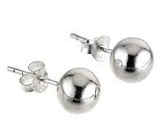 May include: A pair of silver ball stud earrings. Each earring features a polished, spherical design. The earrings have a post and butterfly backing for secure wear. The studs are shown against a white background.