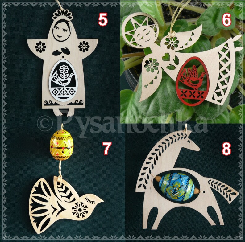 May include: Four wooden ornaments with intricate designs and painted details. Each ornament features a different design: a woman holding an egg, an angel with an egg, a bird with an egg, and a horse with an egg. The ornaments are all white with colorful accents.