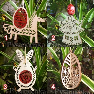 May include: Four wooden Easter ornaments. The ornaments include a horse with an egg, an angel, a bunny, and an egg with birds. Each ornament is made of light-colored wood with red accents and intricate cut-out designs. They hang from a natural twine.