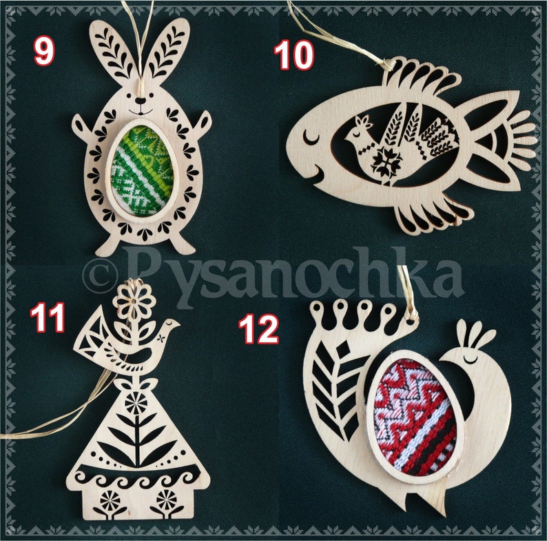 May include: Four wooden ornaments with intricate designs, each featuring a different animal: a bunny, a fish, a bird, and a peacock. Each ornament has a cutout space for a decorative egg with traditional Ukrainian embroidery.