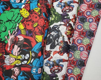 May include: A colorful fabric with a repeating pattern of comic book superheroes, including Captain America, Iron Man, Thor, and Spider-Man. The fabric is white with red, blue, and yellow accents.