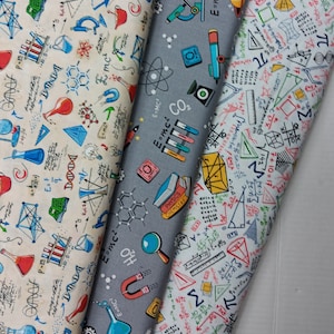 May include: Three fabric swatches with science-themed patterns. One is beige with red and blue lab equipment and formulas. Another is gray with science icons and formulas. The third is white with math equations and geometric shapes.