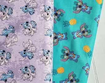 May include: Two fabric swatches with a repeating pattern of Stitch from Lilo & Stitch. The left swatch is purple with a white background and features Stitch with Angel. The right swatch is turquoise with a white background and features Stitch with a lei and pineapple.