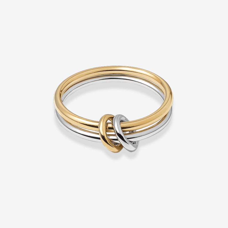 14k gold filled two-tone connected ring set with jump ring connector on a clean white background
