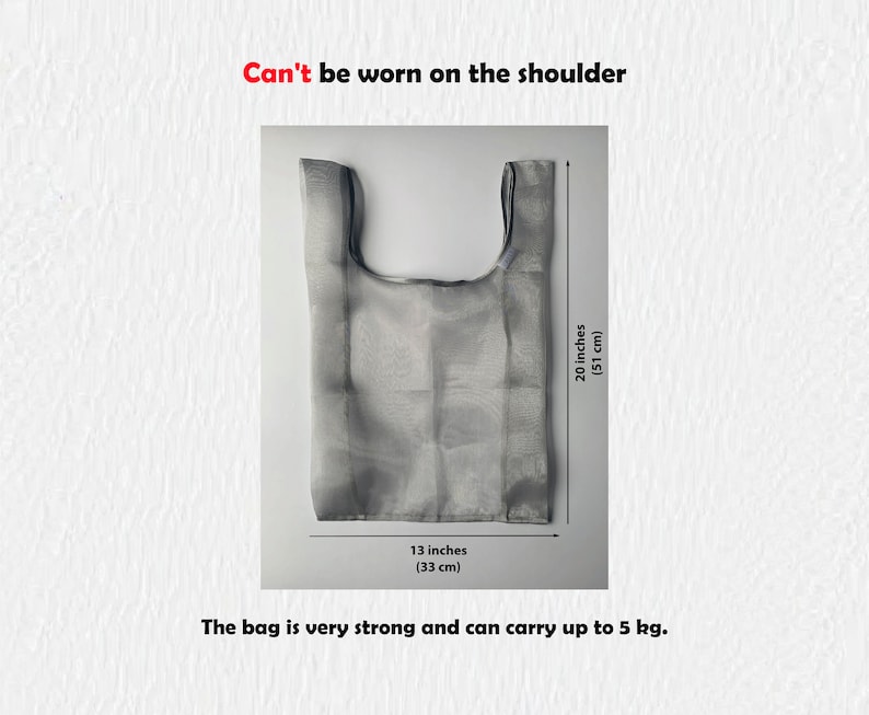 May include: A gray mesh bag with black trim. The bag is 20 inches tall and 13 inches wide. The text on the image reads: 'Can't be worn on the shoulder', '20 inches (51 cm)', '13 inches (33 cm)', and 'The bag is very strong and can carry up to 5 kg.'
