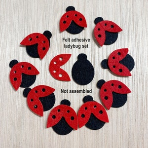 May include: A set of felt ladybug craft supplies. The set includes 10 pieces: 5 red ladybug wings and 5 black ladybug bodies. The pieces are not assembled. The text "Felt adhesive ladybug set" and "Not assembled" is included in the image.