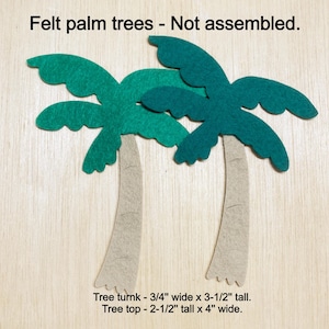 May include: Two felt palm trees, not assembled. Each tree has a green felt top with a brown felt trunk. The tree trunk is 3/4 inch wide by 3 1/2 inches tall. The tree top is 2 1/2 inches tall by 4 inches wide.