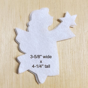 May include: White felt angel cutout with a star in its hand. The angel is 3-5/8" wide x 4-1/4" tall.
