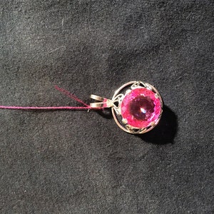 Pink topaz pendant set in sterling silver. Free silver chain with purchase!