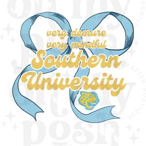 May include: A blue ribbon bow with the text "very demure very mindful Southern University" in yellow. A yellow jaguar mascot is visible in the center of the bow.