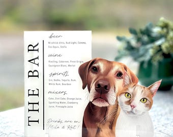 May include: A clear acrylic sign with the text "THE BAR" in large, vertical, black letters. The sign lists various beer, wine, and spirit options, as well as mixers. The text "Drinks are on Milo & Kat!" is at the bottom of the sign. A cartoon illustration of a dog and cat are on the right side of the sign.