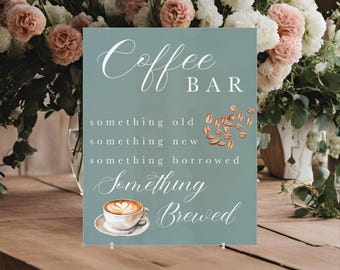 May include: A light blue sign with white text that reads "Coffee Bar" and "Something Old, Something New, Something Borrowed, Something Brewed". The sign also features a watercolor illustration of a cup of coffee with a heart design in the foam.