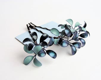 Three hair clips with delicate flowers