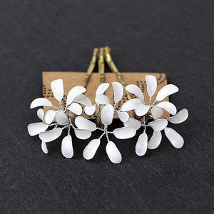 Three hair clips with delicate flowers