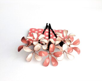 Three hair clips with delicate blossoms