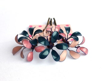 Three hair clips with delicate blossoms