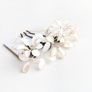 Three hair clips with delicate flowers