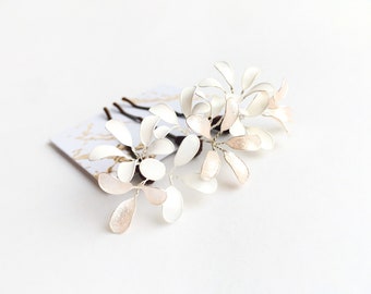 Three hair clips with delicate flowers