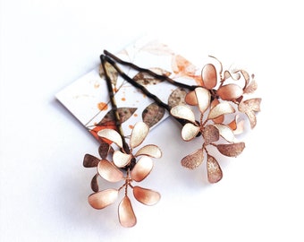 Three hair clips with delicate blossoms