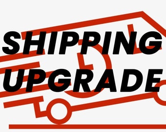 May include: A red truck with the words "SHIPPING UPGRADE" in black text.
