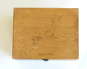 May include: A wooden box with a laser-engraved map of Japan and the text "Japan, 2023".